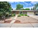 Charming brick ranch home with a manicured front yard and inviting entrance at 1607 Ulysses St, Golden, CO 80401