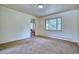Cozy living room featuring neutral carpet and views into the dining area at 1607 Ulysses St, Golden, CO 80401