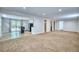 Open-concept floor plan with hardwood-style floors, carpet, and sliding doors leading outside at 1607 Ulysses St, Golden, CO 80401