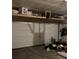 Spacious garage with overhead storage, offering ample room for vehicles and organization at 17910 E 54Th Ave, Denver, CO 80249