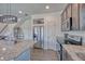 Contemporary kitchen with granite countertops, stainless steel appliances and convenient access to dining area at 17910 E 54Th Ave, Denver, CO 80249