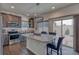 Modern kitchen featuring granite countertops, stainless steel appliances, island and barstool seating at 17910 E 54Th Ave, Denver, CO 80249