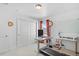 Bright bedroom featuring closet space, home office setup, and a full window letting in natural light at 8353 Bijou Creek Ave, Littleton, CO 80125
