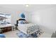 Well-lit bedroom with stylish decor, plush bedding, and ample closet space for a relaxing sanctuary at 8353 Bijou Creek Ave, Littleton, CO 80125