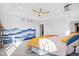 Bedroom with mountain mural, ceiling fan, and a tray ceiling at 8353 Bijou Creek Ave, Littleton, CO 80125