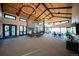 Spacious lounge with vaulted ceilings, stone fireplace, and large windows at 8353 Bijou Creek Ave, Littleton, CO 80125