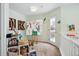 Bright art studio with an easel, natural light, and a door leading to a balcony at 2244 Fenton St, Edgewater, CO 80214