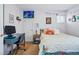 Inviting bedroom with natural light, a cute bed, and an ergonomic desk at 2244 Fenton St, Edgewater, CO 80214