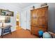 Bedroom featuring a large wardrobe, bathroom access and a cozy decor at 2244 Fenton St, Edgewater, CO 80214