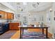 Bright dining area features large windows and a rustic wooden table with a colorful rug at 2244 Fenton St, Edgewater, CO 80214