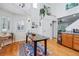 Dining area with lots of natural light, with seating and wooden table at 2244 Fenton St, Edgewater, CO 80214