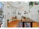 Dining area features a large rustic table, windows, and decorative details at 2244 Fenton St, Edgewater, CO 80214