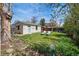 Detached garage with well-maintained lawn, a light blue door, and decorated exterior at 2244 Fenton St, Edgewater, CO 80214