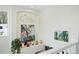 Bright, naturally lit interior with a plant, colorful art, and a unique decorative niche at 2244 Fenton St, Edgewater, CO 80214