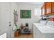 Functional laundry room equipped with washer, dryer, and storage cabinets at 2244 Fenton St, Edgewater, CO 80214
