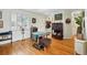 Cozy living room with beautiful hardwood floors, white trim, and bright natural light at 2244 Fenton St, Edgewater, CO 80214