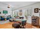 Inviting living room with hardwood floors, ample seating, and bright natural light at 2244 Fenton St, Edgewater, CO 80214