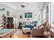 Relaxing living area with bright walls, patterned sofa, and warm natural light at 2244 Fenton St, Edgewater, CO 80214