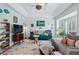 Spacious living room, hardwood floors, sofa, TV and white walls at 2244 Fenton St, Edgewater, CO 80214