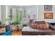 Comfortable living room, with hardwood floors, shutters, a chaise and plush pillows at 2244 Fenton St, Edgewater, CO 80214