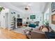 Living room featuring hardwood floors, colorful accents, and a cozy atmosphere at 2244 Fenton St, Edgewater, CO 80214
