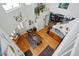 Open living space with hardwood floors, an inviting dining area, and a staircase leading to a cozy den at 2244 Fenton St, Edgewater, CO 80214