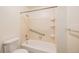 Bathroom featuring a tub, toilet, and updated hardware at 360 Upham St, Lakewood, CO 80226