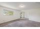 Bedroom featuring neutral carpet and sliding glass door to balcony at 360 Upham St, Lakewood, CO 80226
