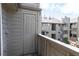 Cozy balcony features a storage closet with views of the surrounding complex at 3100 S Federal Blvd # 307, Denver, CO 80236