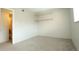 Neutral bedroom with carpet, built in shelving and an ensuite bathroom at 3100 S Federal Blvd # 307, Denver, CO 80236