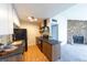 Charming kitchen features modern appliances, dark countertops and unique backsplash at 3100 S Federal Blvd # 307, Denver, CO 80236