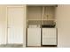 Laundry room featuring a washer and dryer, with a storage shelf above at 3100 S Federal Blvd # 307, Denver, CO 80236