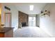 Open floorplan living room featuring a fireplace, and sliding glass doors at 3100 S Federal Blvd # 307, Denver, CO 80236