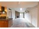 Open floorplan living room featuring a fireplace, and sliding glass doors at 3100 S Federal Blvd # 307, Denver, CO 80236