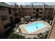 Aerial shot of complex pool with residents enjoying a swim on a sunny day at 3100 S Federal Blvd # 307, Denver, CO 80236