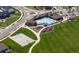 Aerial view of a pool, playground, and basketball court at 17850 W 94Th Dr, Arvada, CO 80007