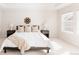 Bright bedroom with a cozy bed, stylish decor, and natural light streaming through the window at 17850 W 94Th Dr, Arvada, CO 80007