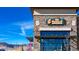 A stone building with a 'The Bluegrass Coffee & Bourbon Lounge' sign at 17850 W 94Th Dr, Arvada, CO 80007