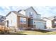 Charming two-story home with stone accents, attached garage, and well-maintained lawn at 17850 W 94Th Dr, Arvada, CO 80007