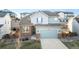 Charming two-story home features a two-car garage and a well-maintained lawn at 17850 W 94Th Dr, Arvada, CO 80007
