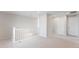 Bright hallway featuring neutral walls, carpet, and a chandelier at 17850 W 94Th Dr, Arvada, CO 80007