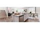 Open-concept kitchen boasts stainless steel appliances, granite countertops, and view of living room at 17850 W 94Th Dr, Arvada, CO 80007