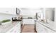 Bright kitchen features stainless steel appliances, granite countertops, and a large center island at 17850 W 94Th Dr, Arvada, CO 80007