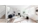 Bright living room features modern decor, fireplace and large windows at 17850 W 94Th Dr, Arvada, CO 80007