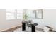 A bright home office with a minimalist design and light wood flooring and stylish desk at 17850 W 94Th Dr, Arvada, CO 80007