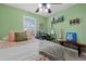 Charming bedroom featuring a comfortable bed, and an artist's corner with ample natural light at 5400 Heatherton Ln, Highlands Ranch, CO 80130