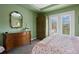 Bedroom featuring a ceiling fan, and a decorative armoire and dresser for storage at 5400 Heatherton Ln, Highlands Ranch, CO 80130