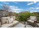 Inviting outdoor deck featuring comfortable seating, black railings and serene neighborhood views at 5400 Heatherton Ln, Highlands Ranch, CO 80130