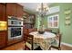 Charming dining area with a chandelier and plenty of natural light at 5400 Heatherton Ln, Highlands Ranch, CO 80130