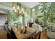 Elegant dining area featuring a wooden table, a chandelier, staircase, and open-concept design at 5400 Heatherton Ln, Highlands Ranch, CO 80130